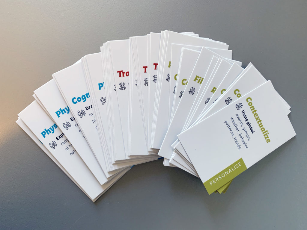 small colorful cards with text fanned out on a table